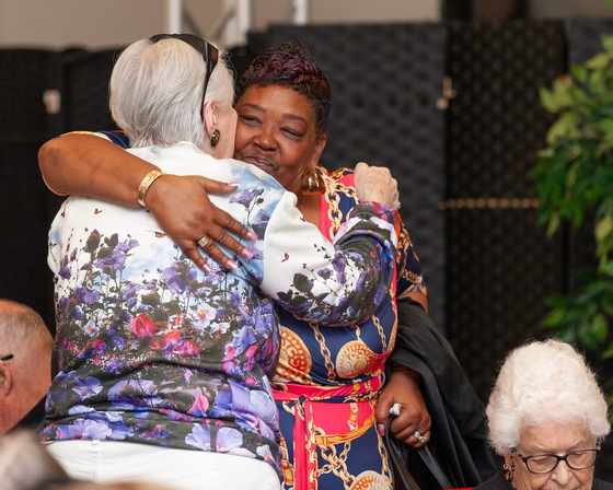Recovery Café DC members embracing, a moment of connection and support
